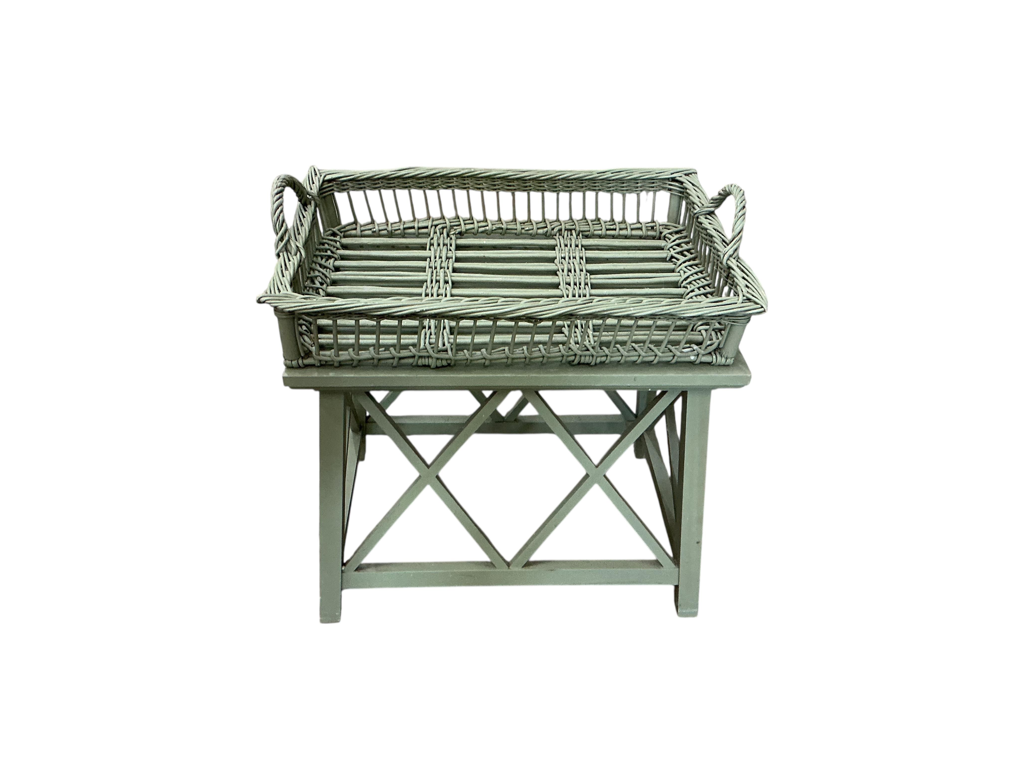 A Contemporary green wicker conservatory suite, comprising three seater settee, armchair, footstool and tray top table